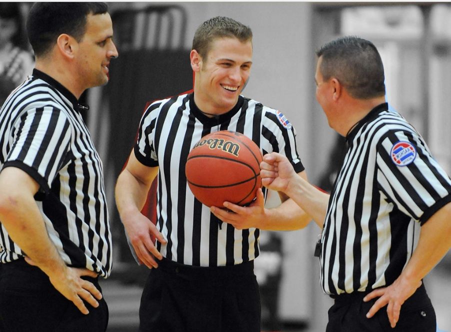 A BASKETBALL REFEREE TOSSES THE BALL STRAIGHT: MASTERING PRECISION AND FAIR PLAY